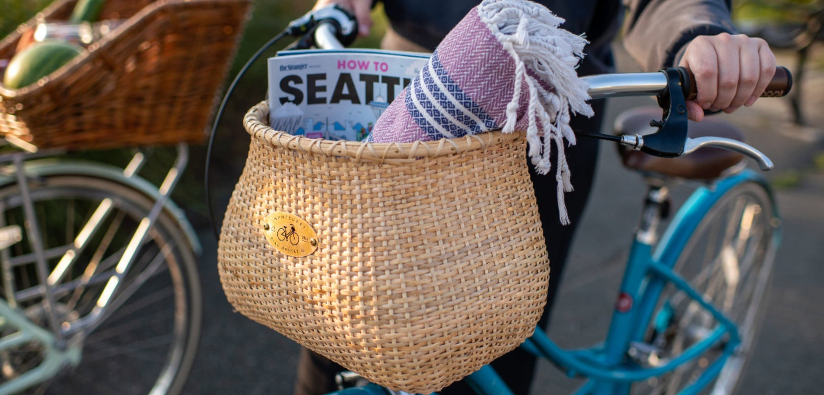 Bicycle basket with a newspaper and towel, blurred background